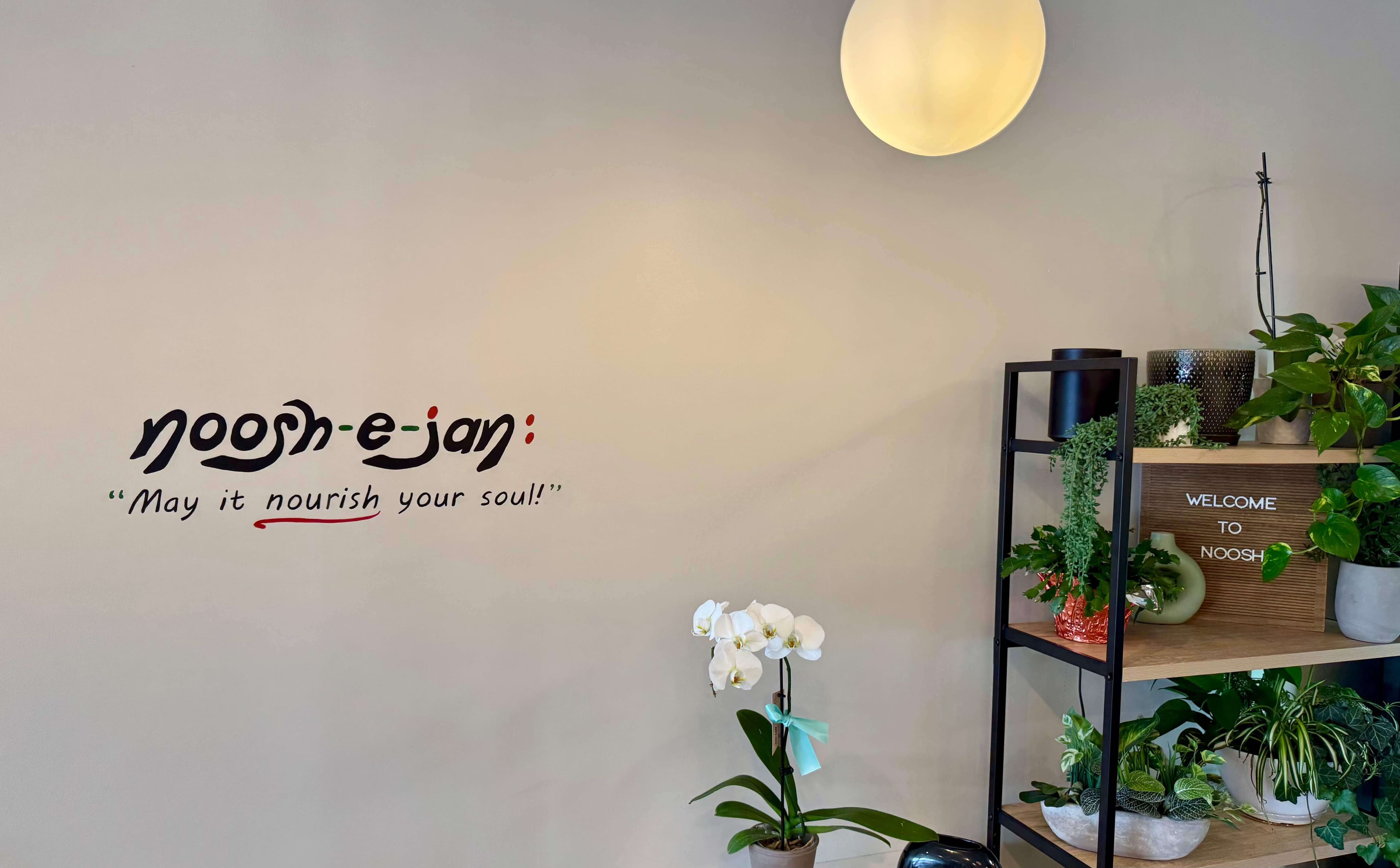 Inside Noosh Grill — a welcoming dining space in Fairfax, VA